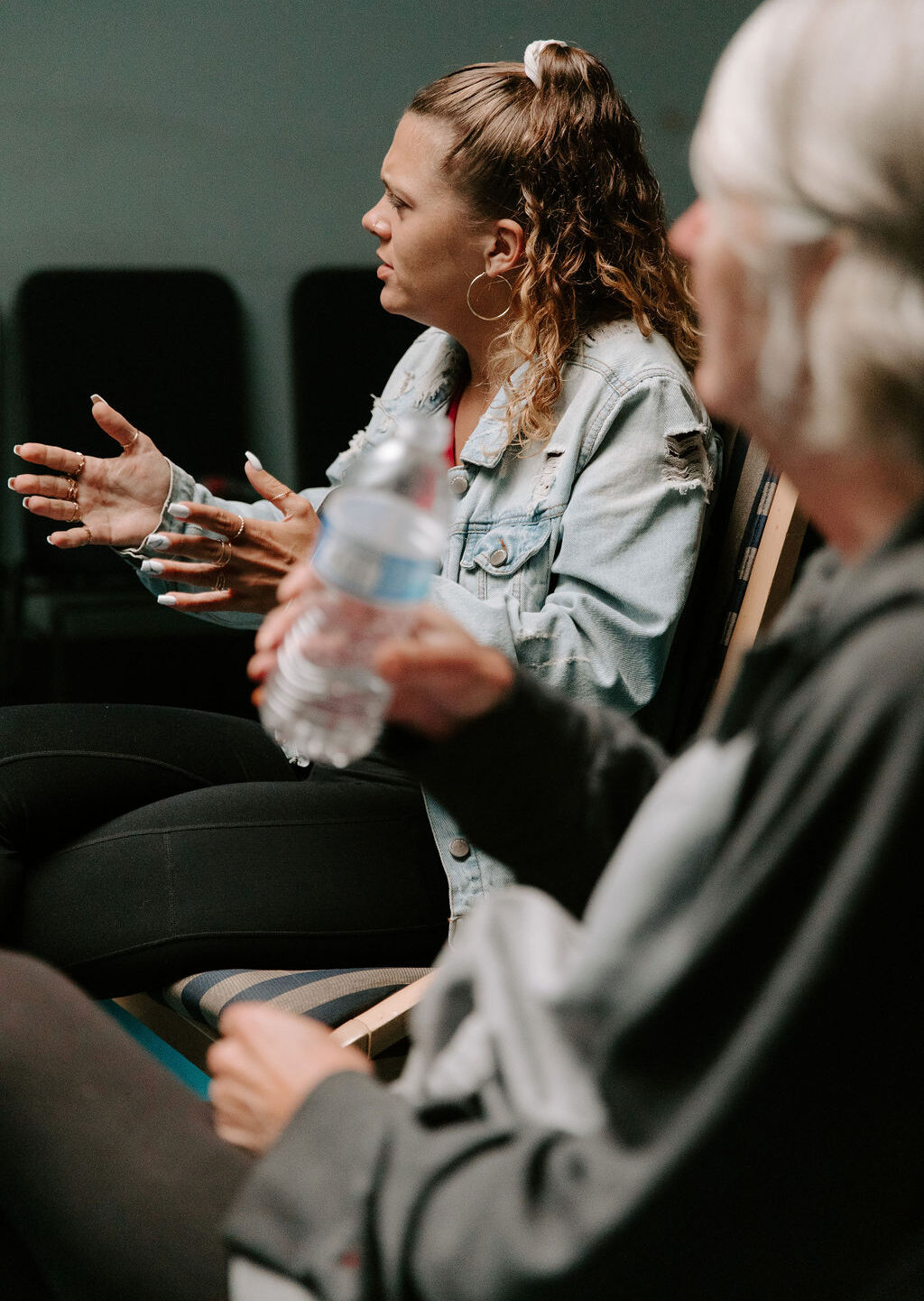 woman speaking in addiction recovery session